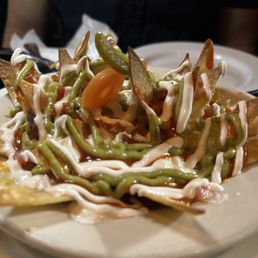 La Contenta signature dishes La Contenta NachosEnchiladas SuizasGuacamole TradicionalTacos de Carne Asada